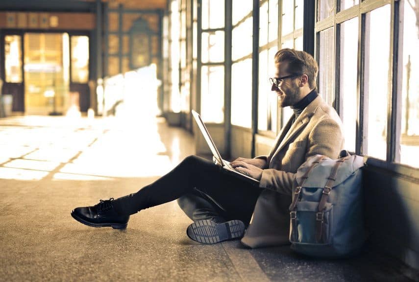 man using free internet at airport