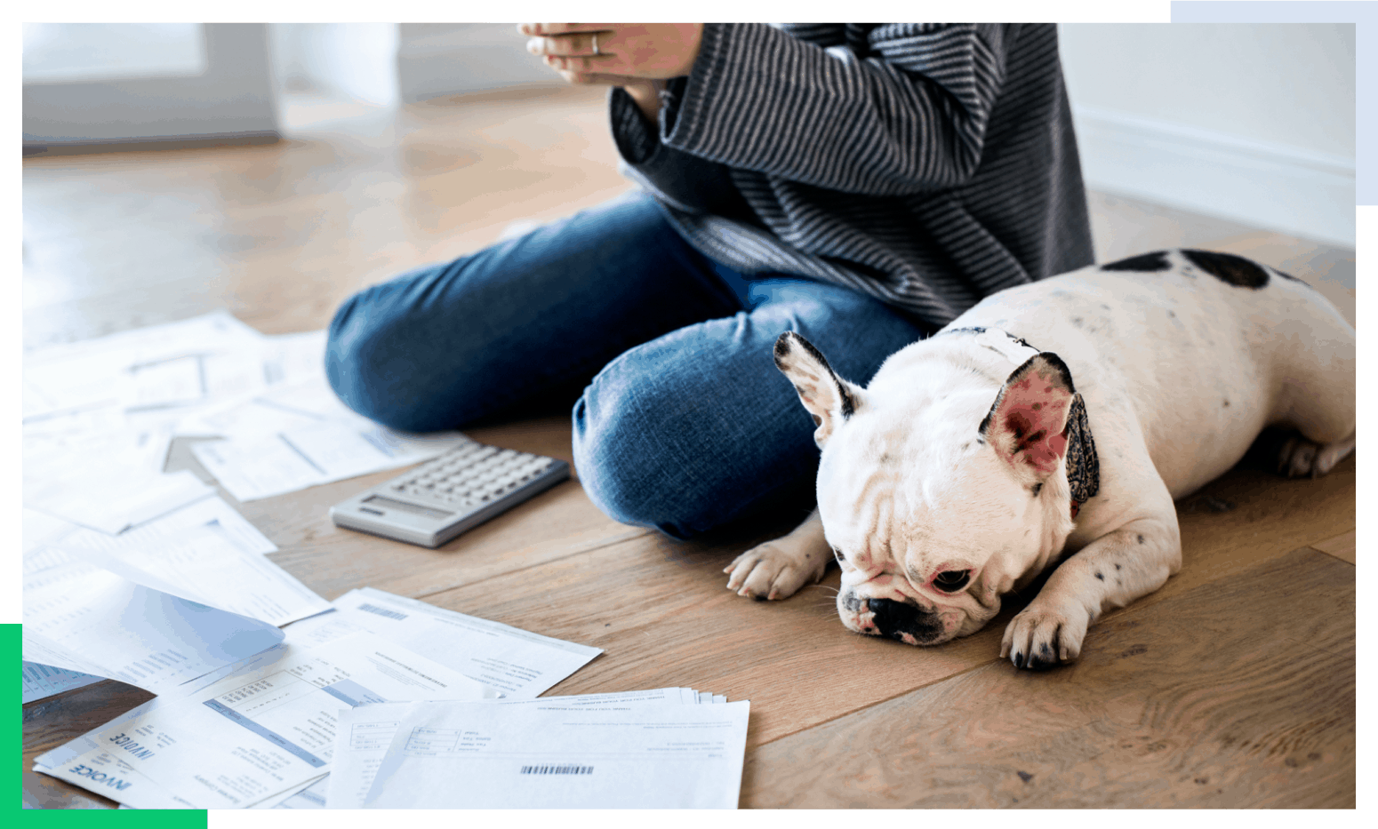woman sitting on floor looking at bills