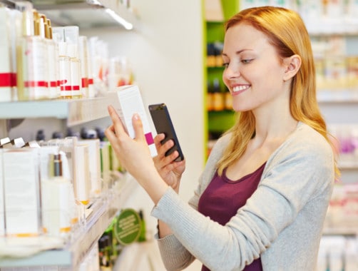 woman using cash back app to save money