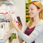 woman using cash back app to save money