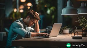 A stressed out freelancer sitting at his desk, contemplating if he should accept another gig for no pay.