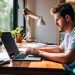 man working at laptop to create a digital product