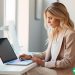 woman at laptop researching new side hustle ideas