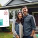 A husband and wife standing in front of their rental property that they use for Airbnb. There is an earnings screenshot showing their an overview of their revenue history.