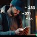 An unassuming man walking down the street and looking at his phone. There are small graphics emanating from the phone showing +$5, +$25, +$50.