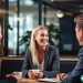 A woman sitting across from two hiring managers, negotiating her starting salary for her new job.