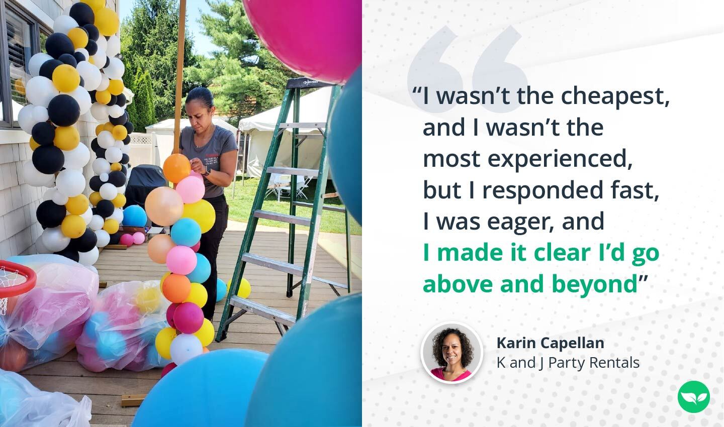 Karin Capellan carefully assembling a colorful balloon installation outdoors, with a black, yellow, and white balloon arch in the background.