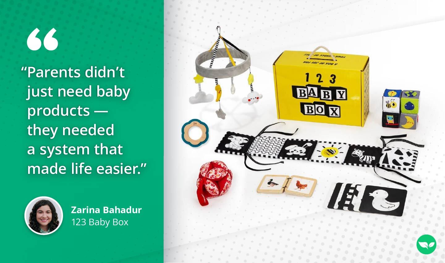 A yellow 123 Baby Box displayed alongside curated baby essentials, including sensory toys, books, and a mobile, with a quote from Zarina Bahadur.