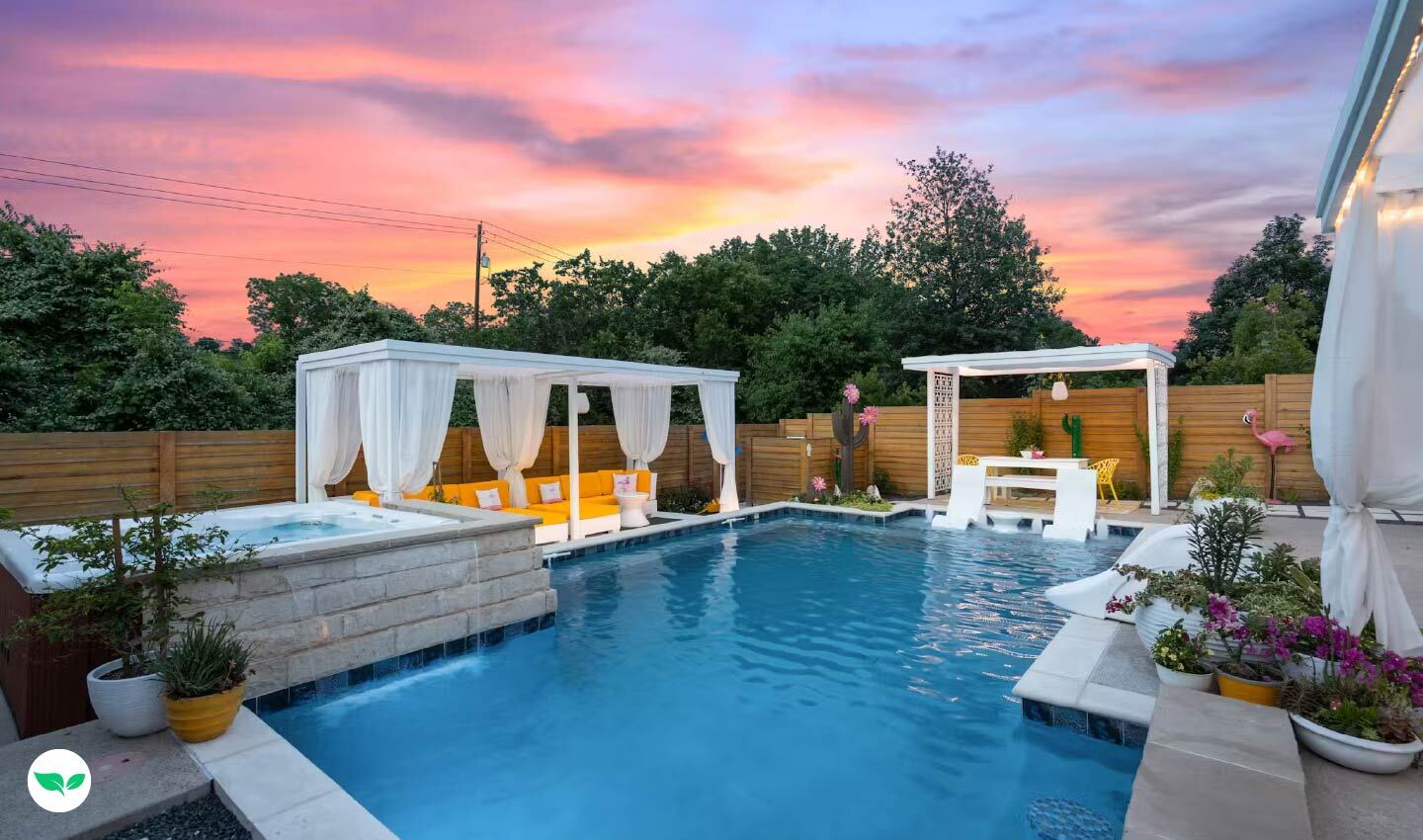 Sunset view of The 6612’s upgraded cabana and lounge area with cozy seating, colorful decor, and a private backyard ambiance