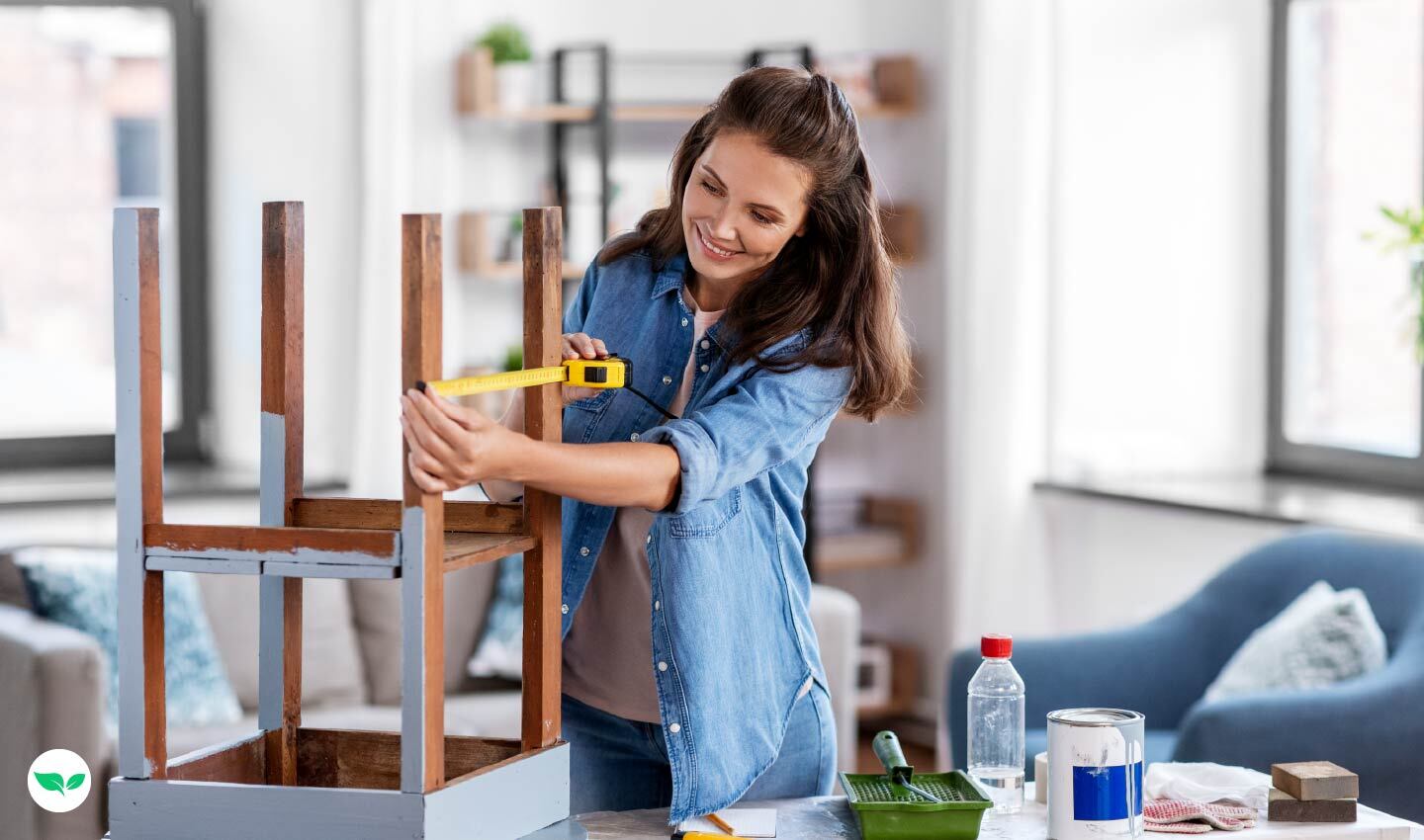 Woman measuring and restoring a wooden chair, illustrating a furniture flipping side hustle.