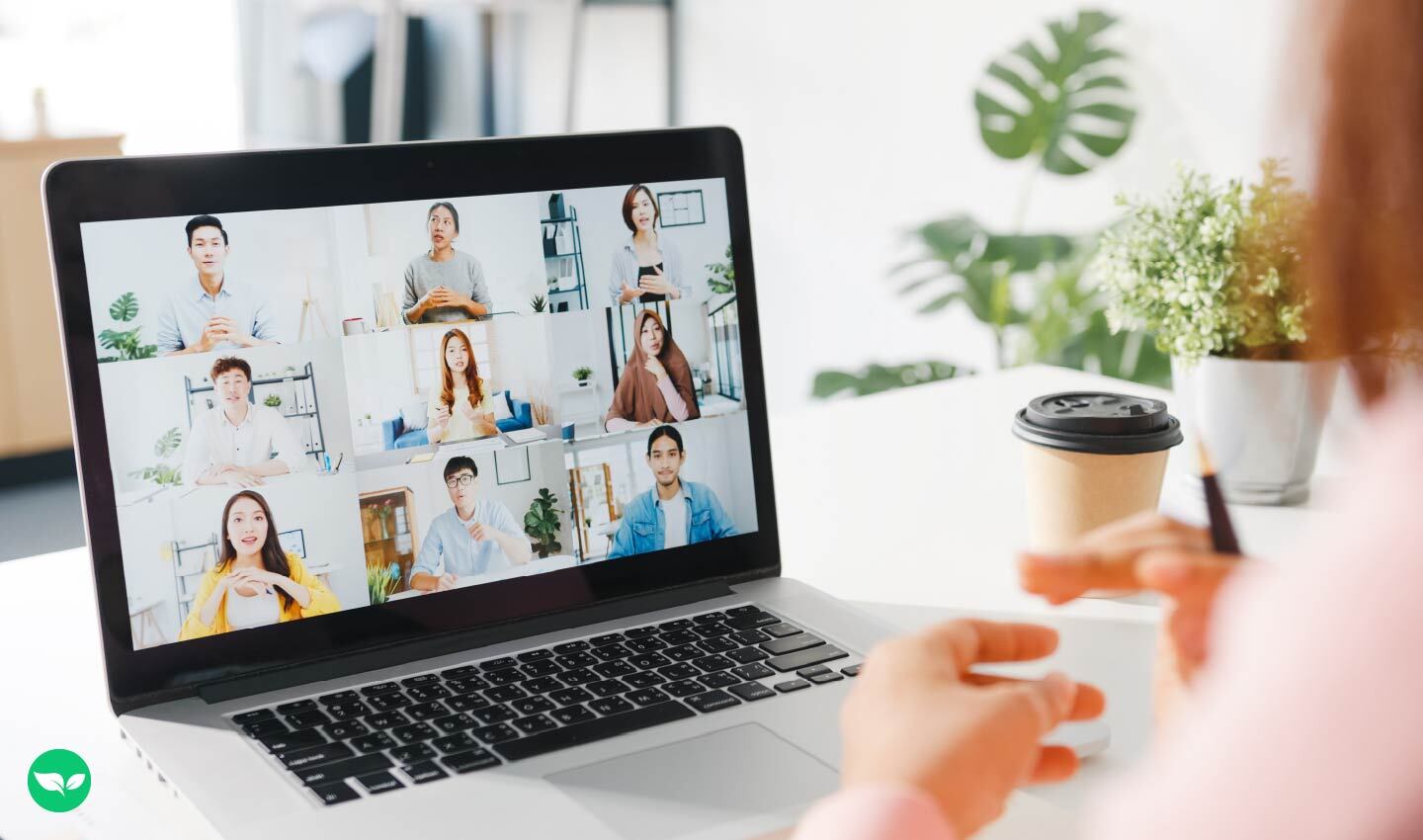Person attending a virtual group session on a laptop, possibly for an online course or membership.