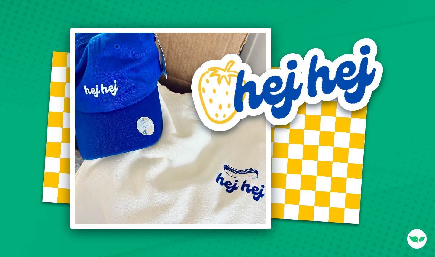 Branded Chef Hej Hej merch, including a royal blue cap and cream sweatshirt with hot dog logo embroidery.