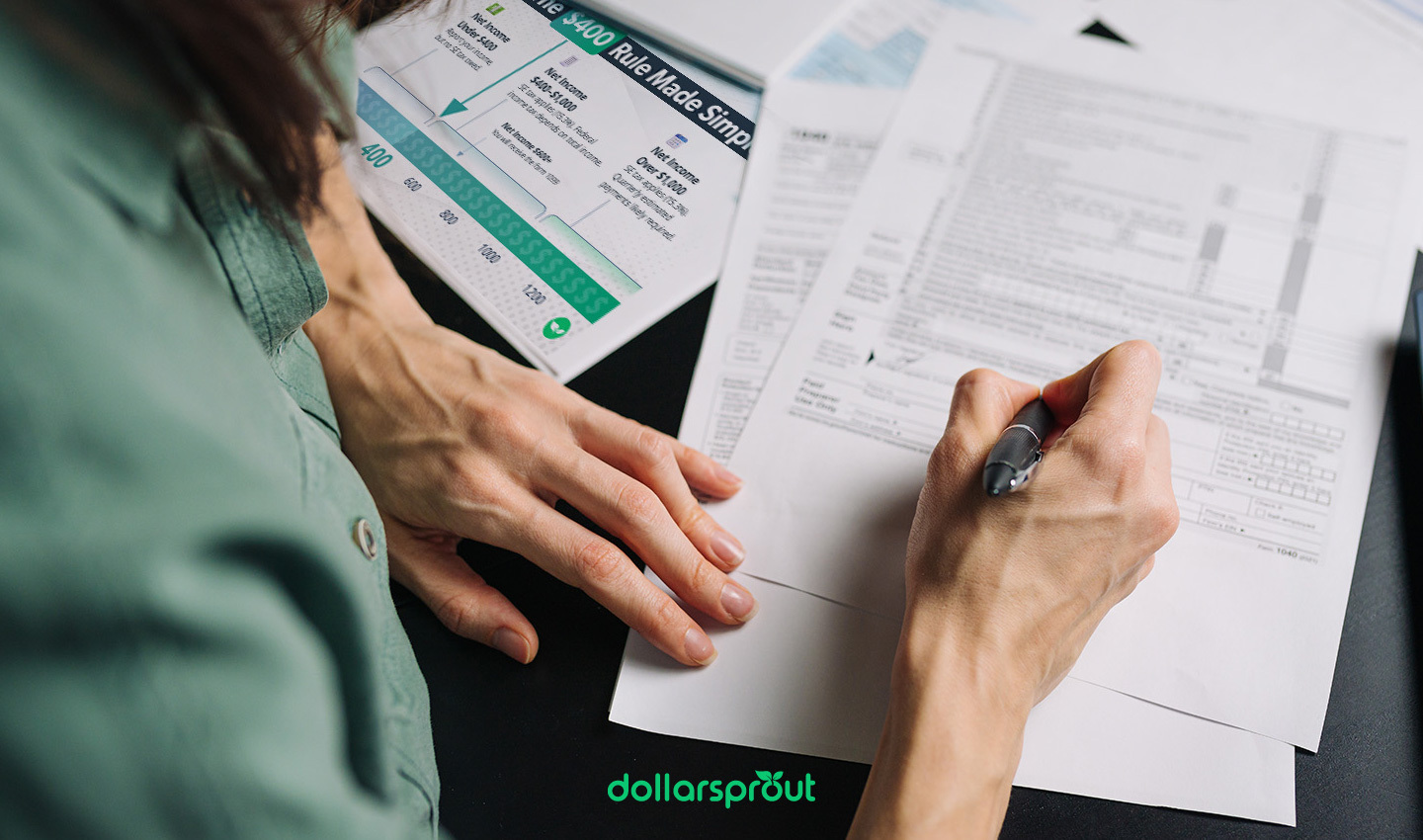 Person reviewing tax paperwork at a desk with a printed $400 Rule Made Simple chart nearby, illustrating when side hustlers owe self-employment tax. The image represents organizing finances and understanding the $400 tax threshold for freelancers and gig workers.